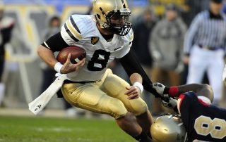 American football players fighting over the ball - Tendo Sport