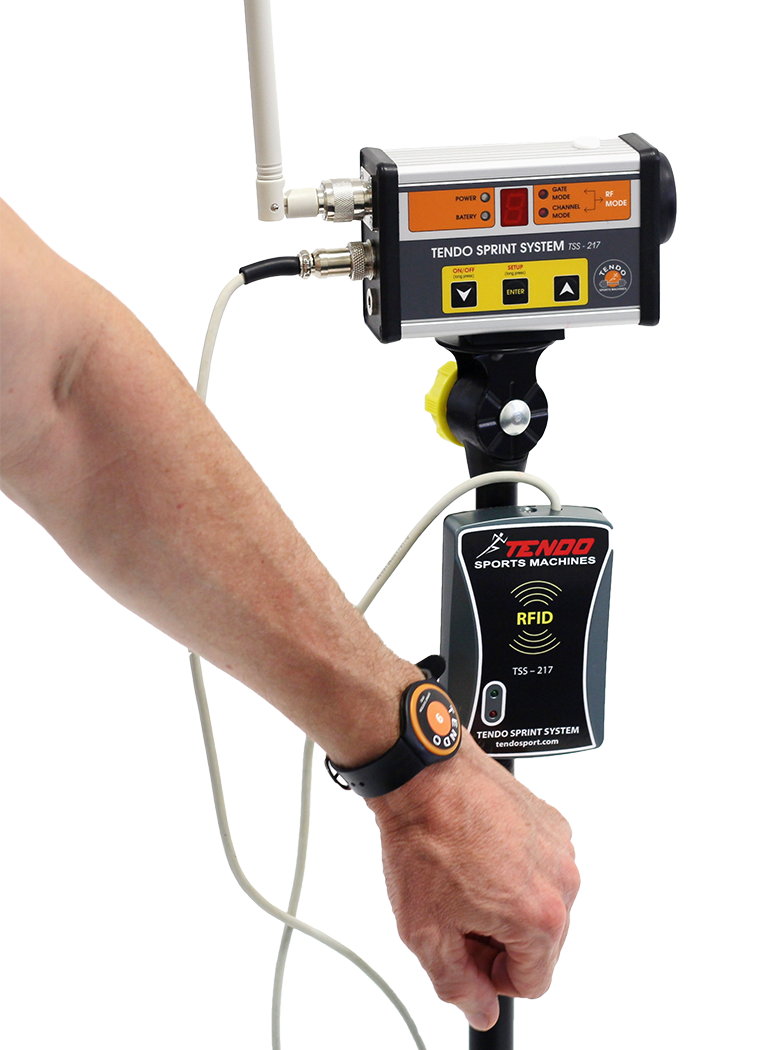Tendo Sprint System RFID set A man athlete touching Tendo Sprint System RFID reader, attached to Tendo Sprint System start photocell, with his Tendo Sprint System RFID wrist band